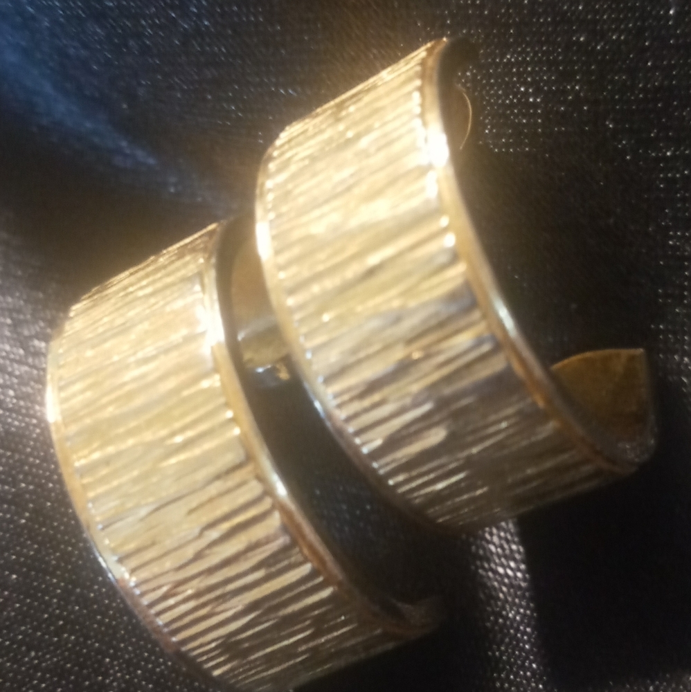 Vintage Trifari gold half hoop earrings stamped in excellent condition.